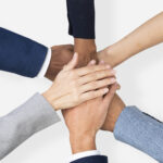 Diverse hands united business teamwork gesture